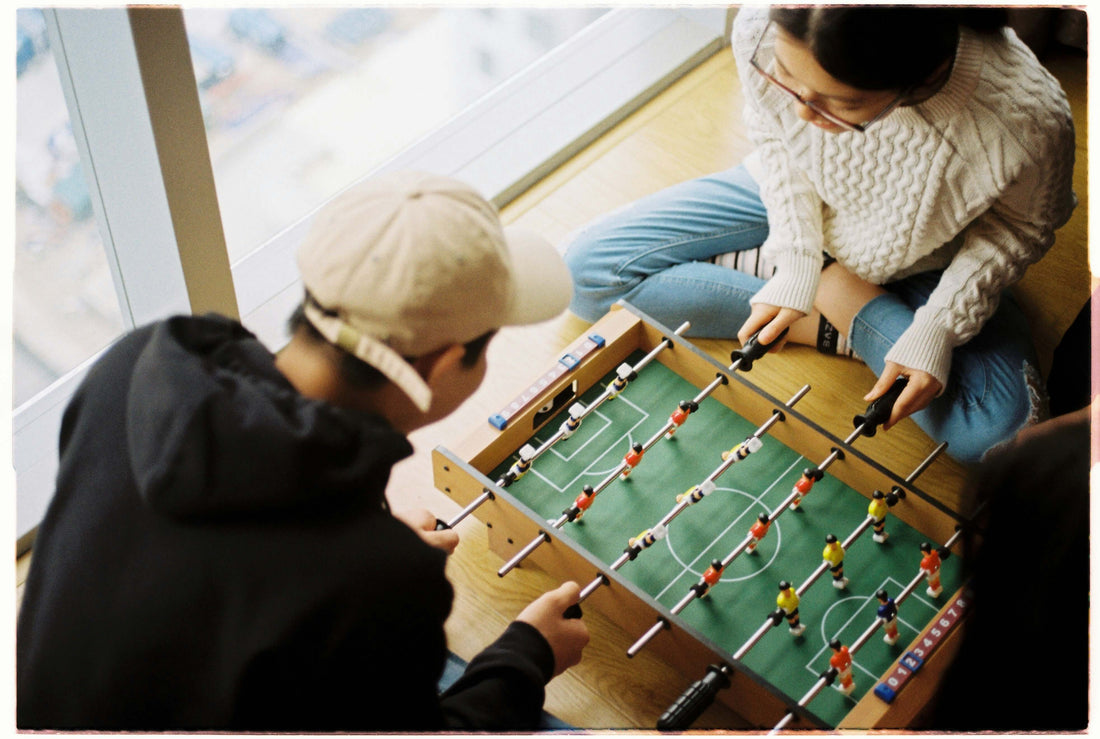 people playing foosball