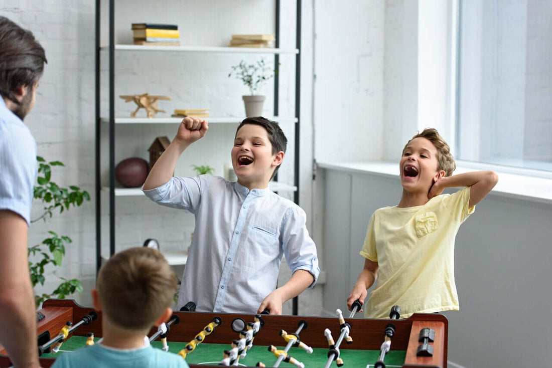 family playing foosball
