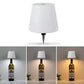 Collage of a LED Bottle Table Lamp  from a wine bottle with a white shade, shown in different lighting conditions.