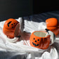 Ceramic Pumpkin Mug with Ghost Handle and Halloween Theme Design