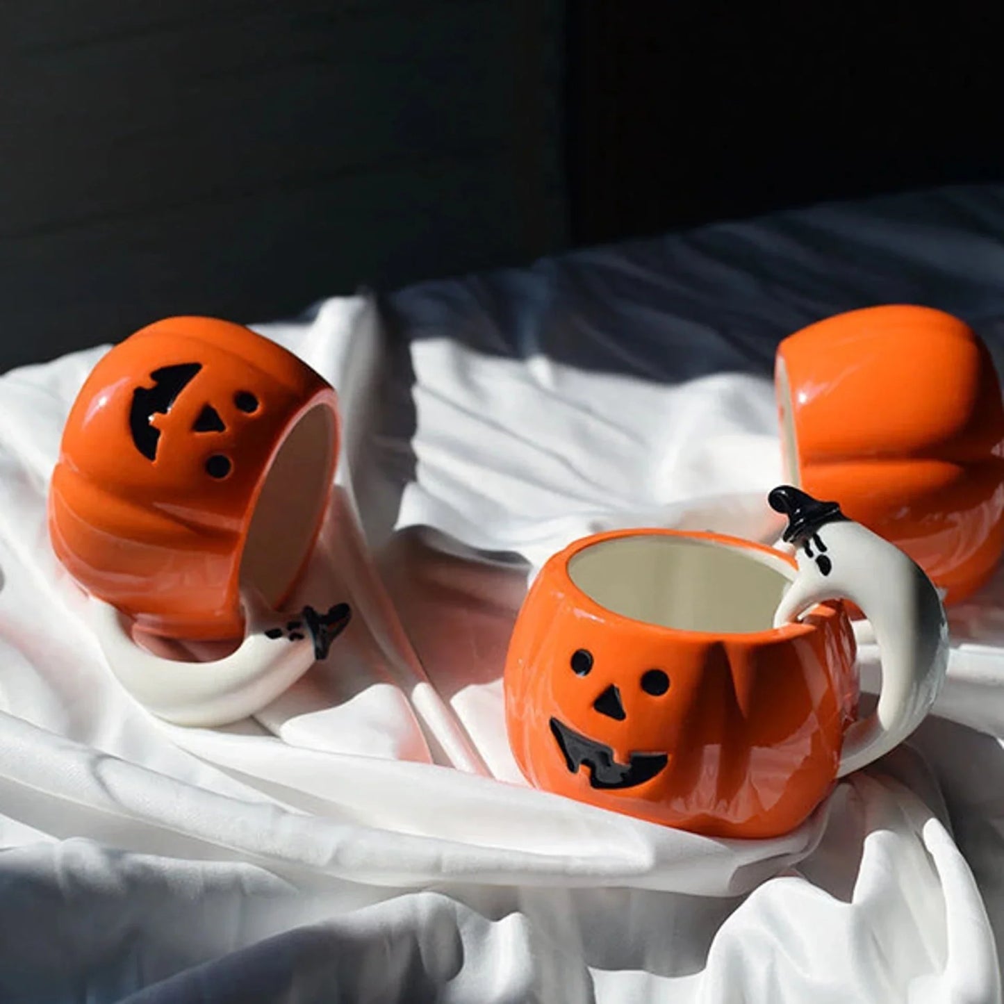 Ceramic Pumpkin Mug with Ghost Handle and Halloween Theme Design