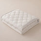 Temperature Regulating Mattress Pad with Quilted Air Channels and Grip Backing
