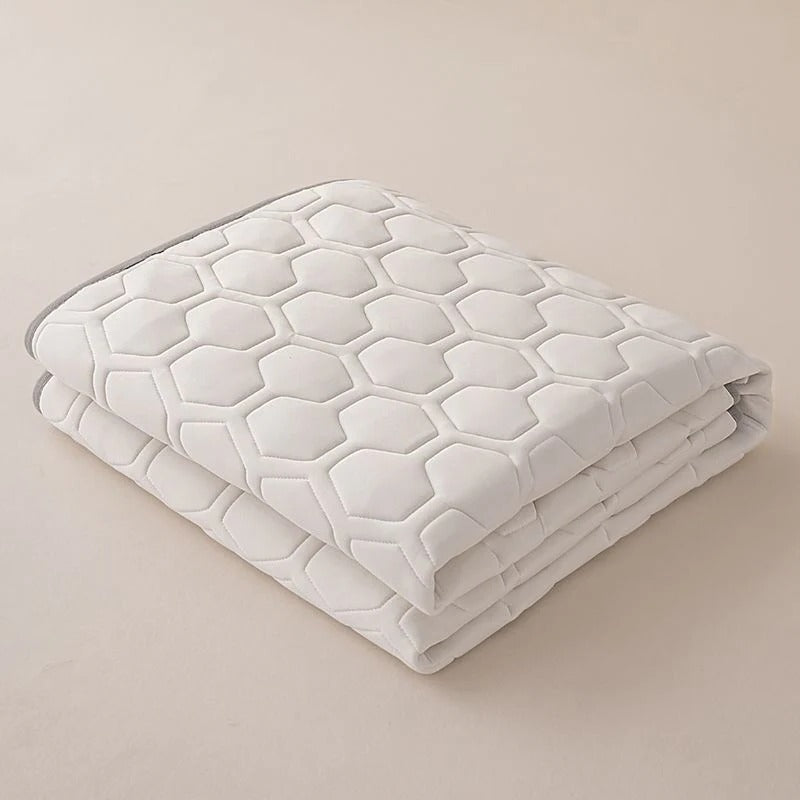 Temperature Regulating Mattress Pad with Quilted Air Channels and Grip Backing
